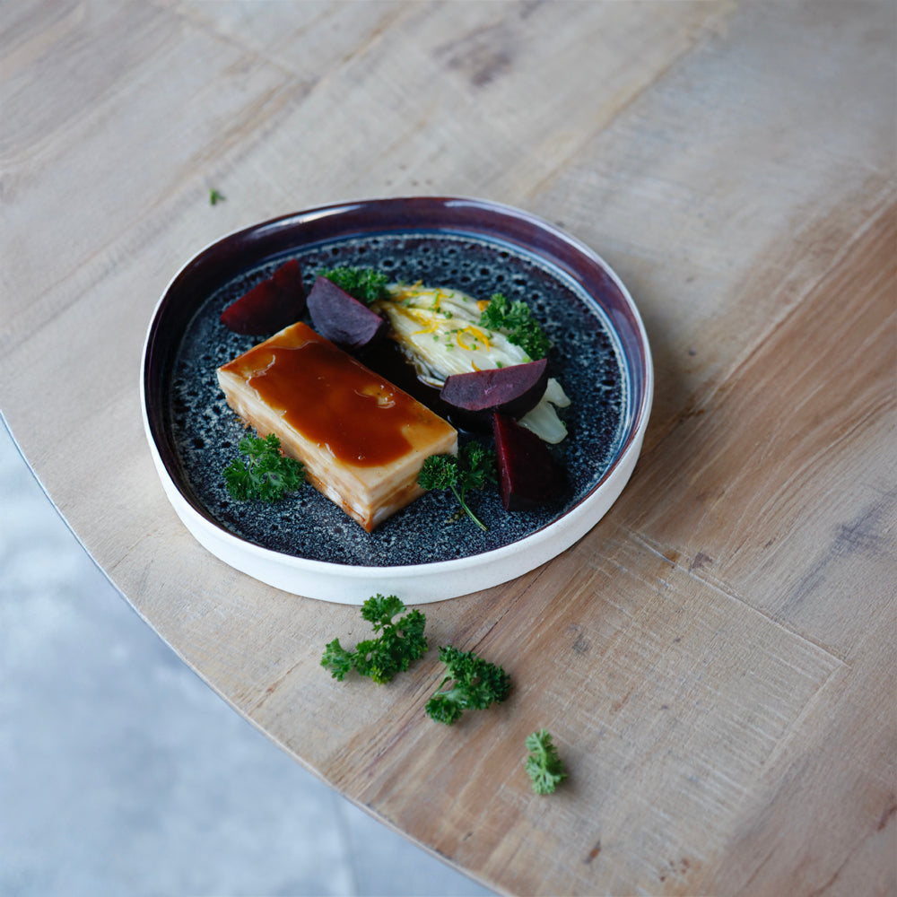Low temperature segovia piglet, citrus endive, demiglace