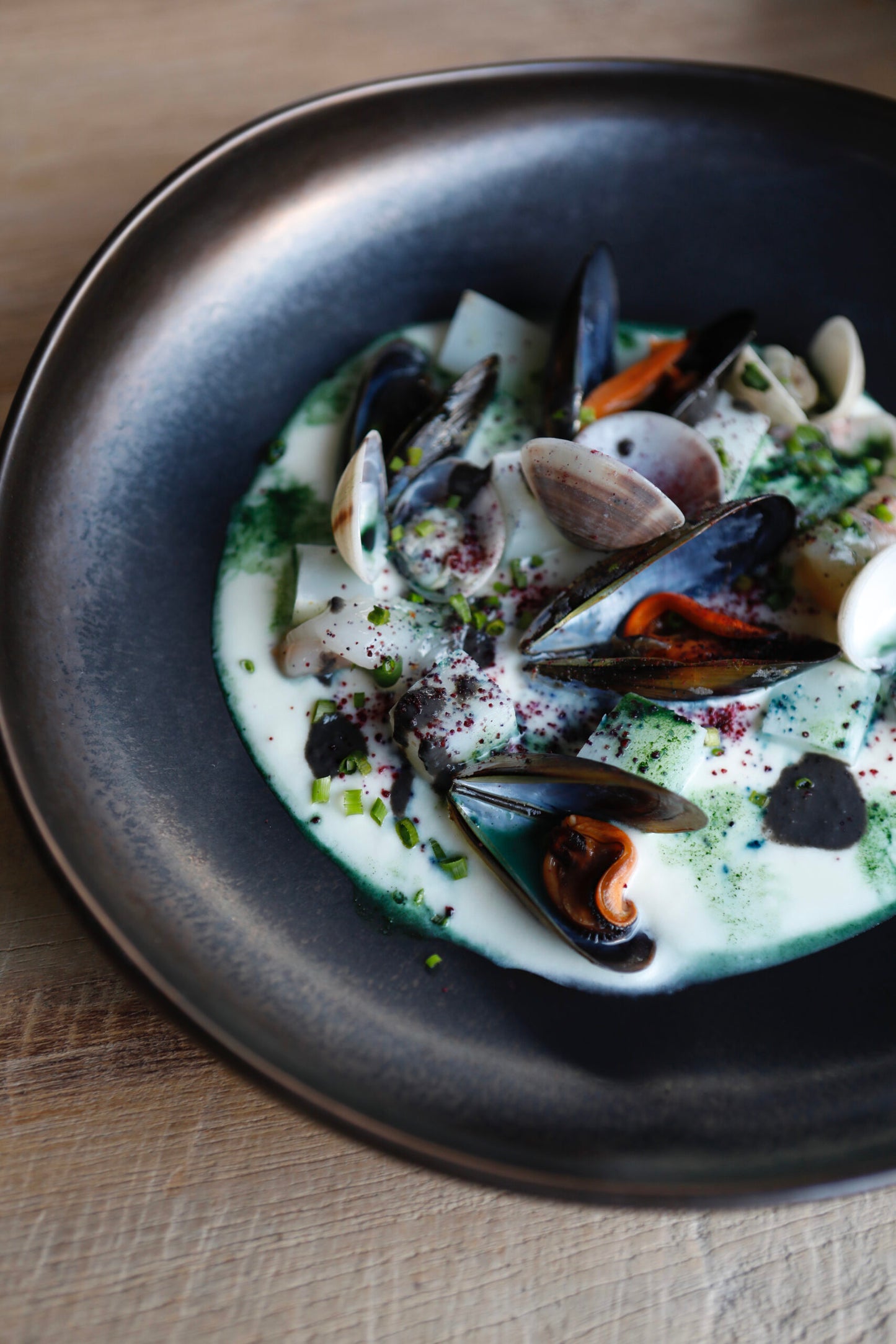 Venetian plated cappuccino, potatoes cream, mussels and cuttlefish