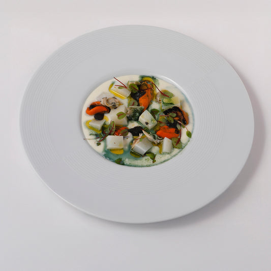Venetian plated cappuccino, potatoes cream, mussels and cuttlefish