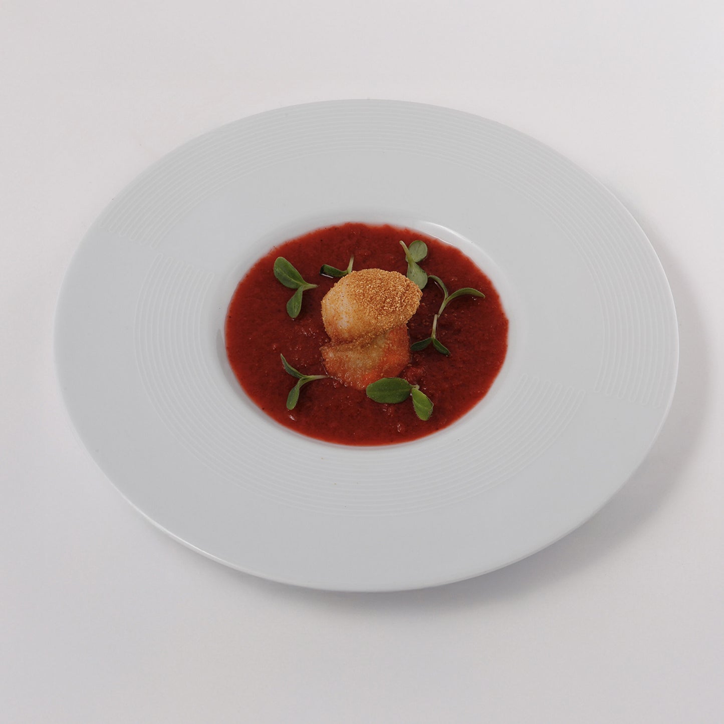 Strawberry and Cava sorbet, seared scallops, mint leaves