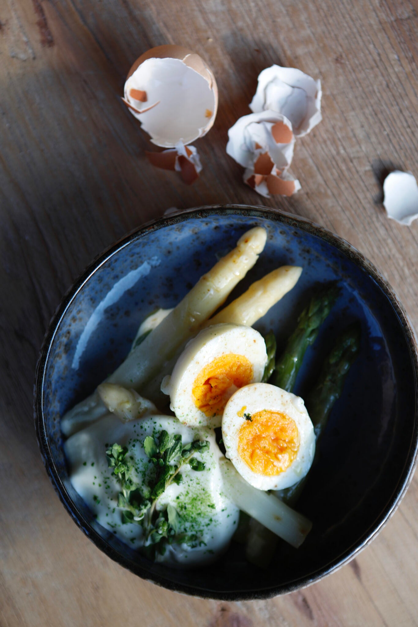 Eggs, white and green asparagus, potato cream and liquorice