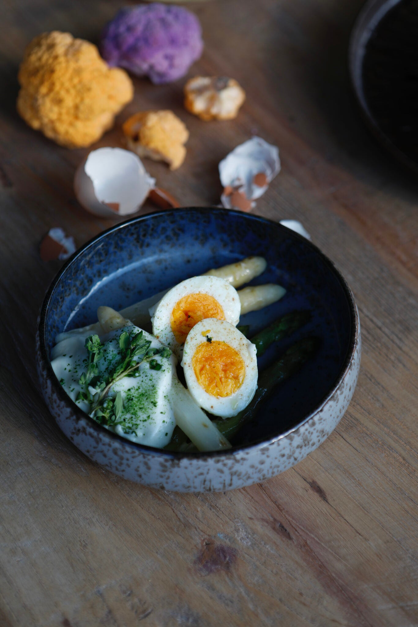 Eggs, white and green asparagus, potato cream and liquorice