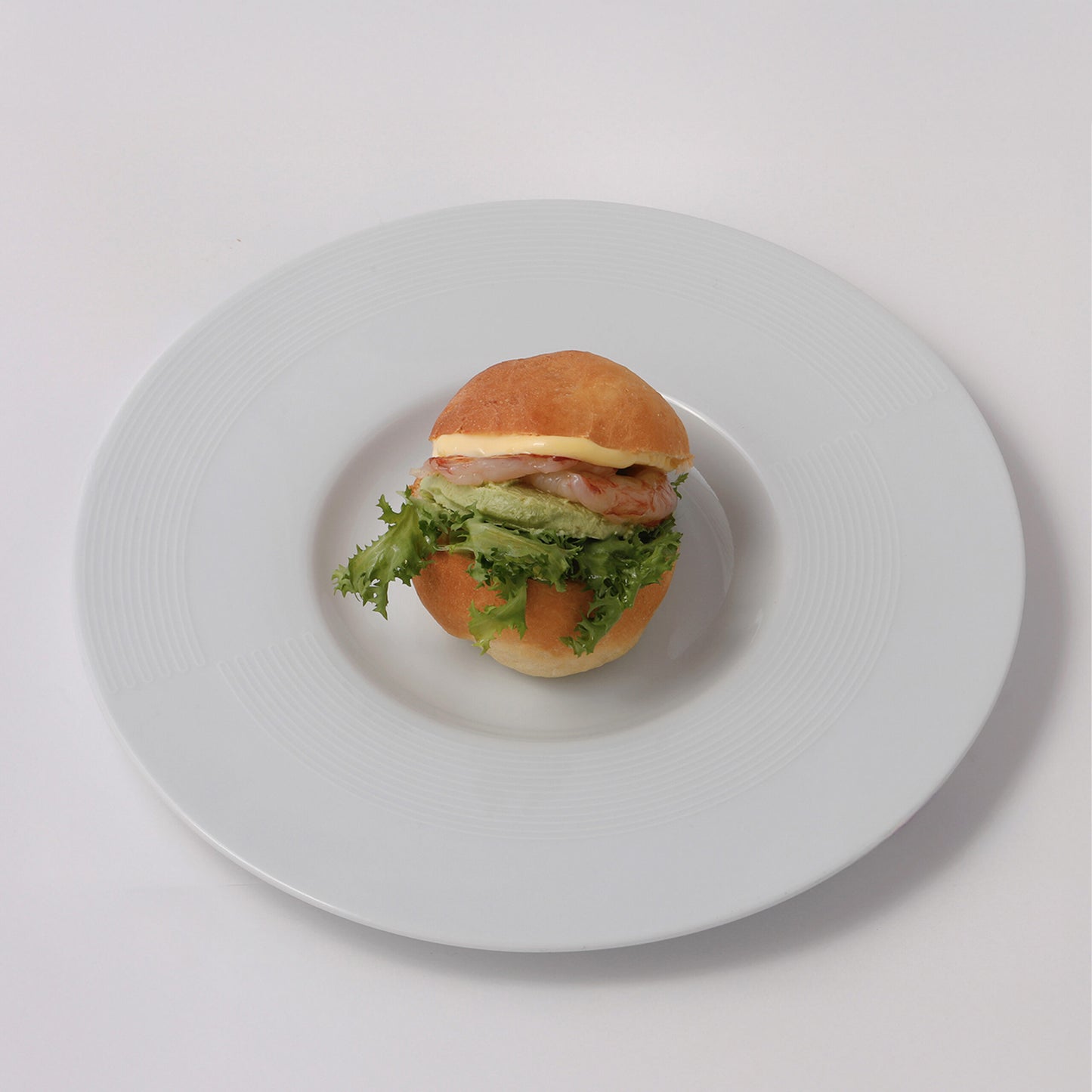 Savory doughnut, red Balearic shrimps, avocado, old mustard mayo, salad