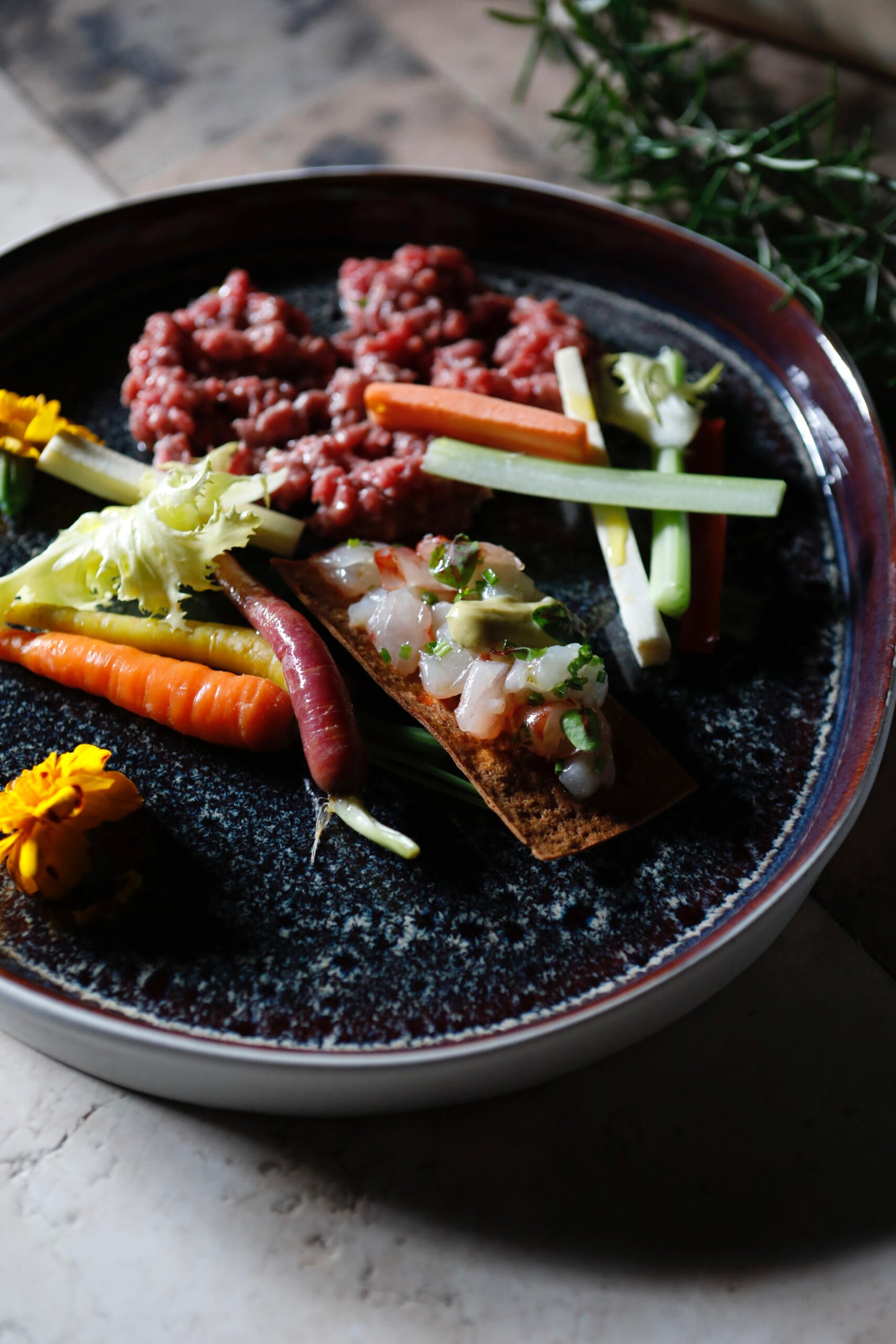 Mixed raw fish cracker, beef tartare, tarragon and old mustard mayo, baby carrots