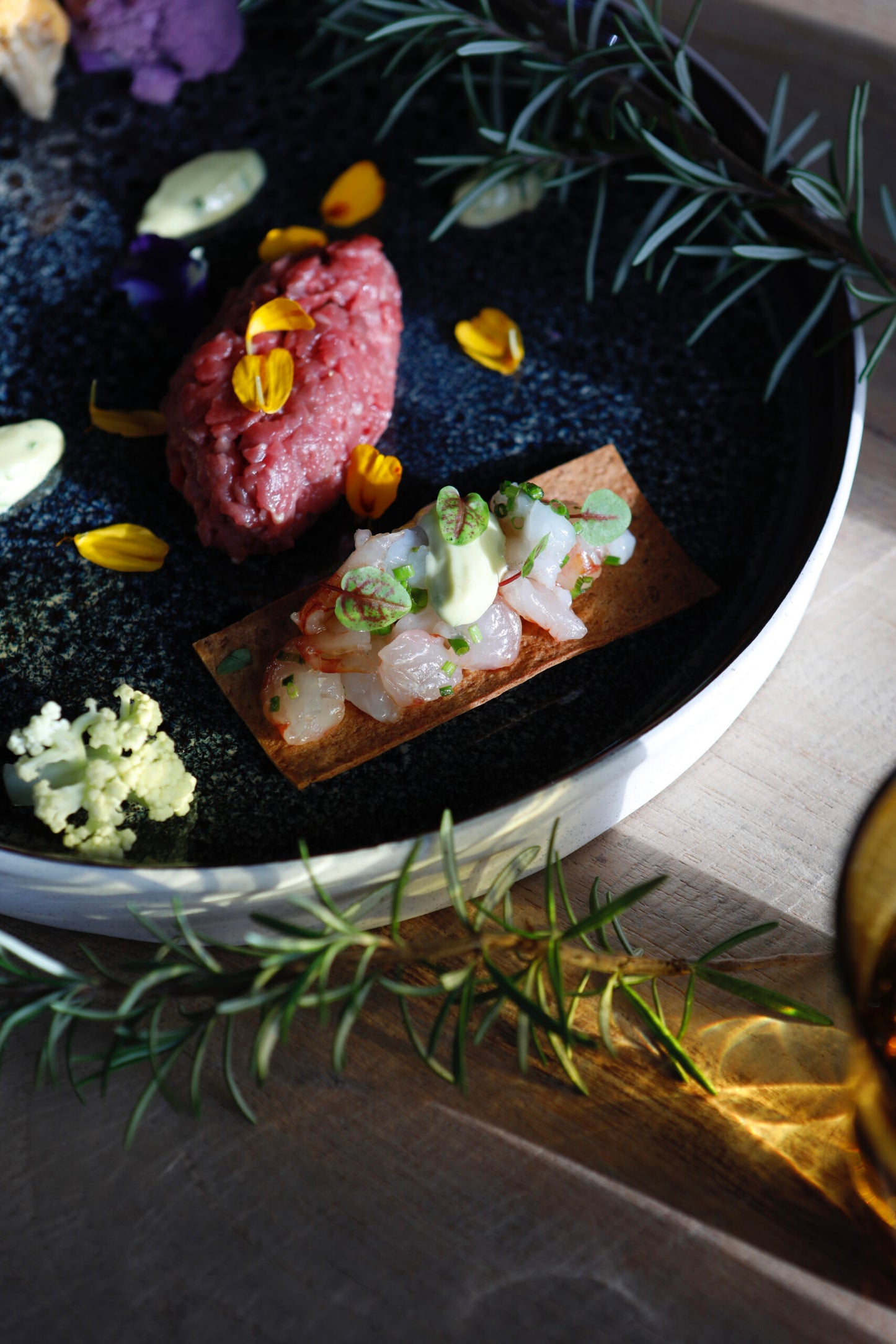 Mixed raw fish cracker, beef tartare, tarragon and old mustard mayo, baby carrots