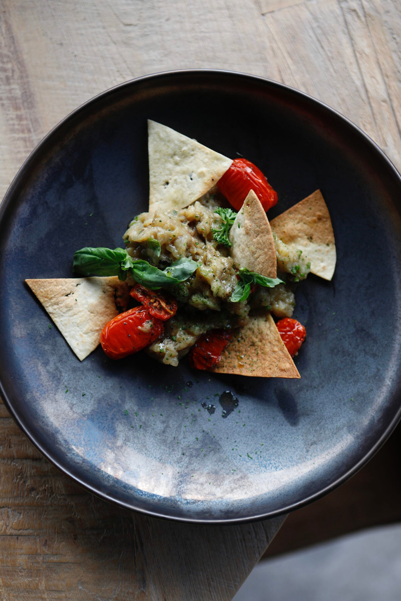 Smoked aubergine, confit cherry tomatoes, Sardinian guttiau carasau bread