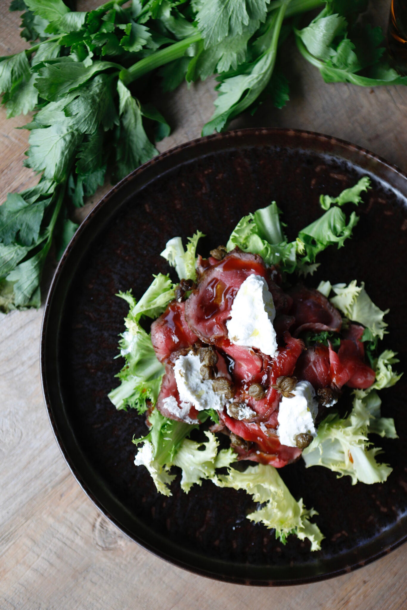Roast beef, thyme ricotta, charcoal smoked oil, capers pop corns, curd salad, beef juice