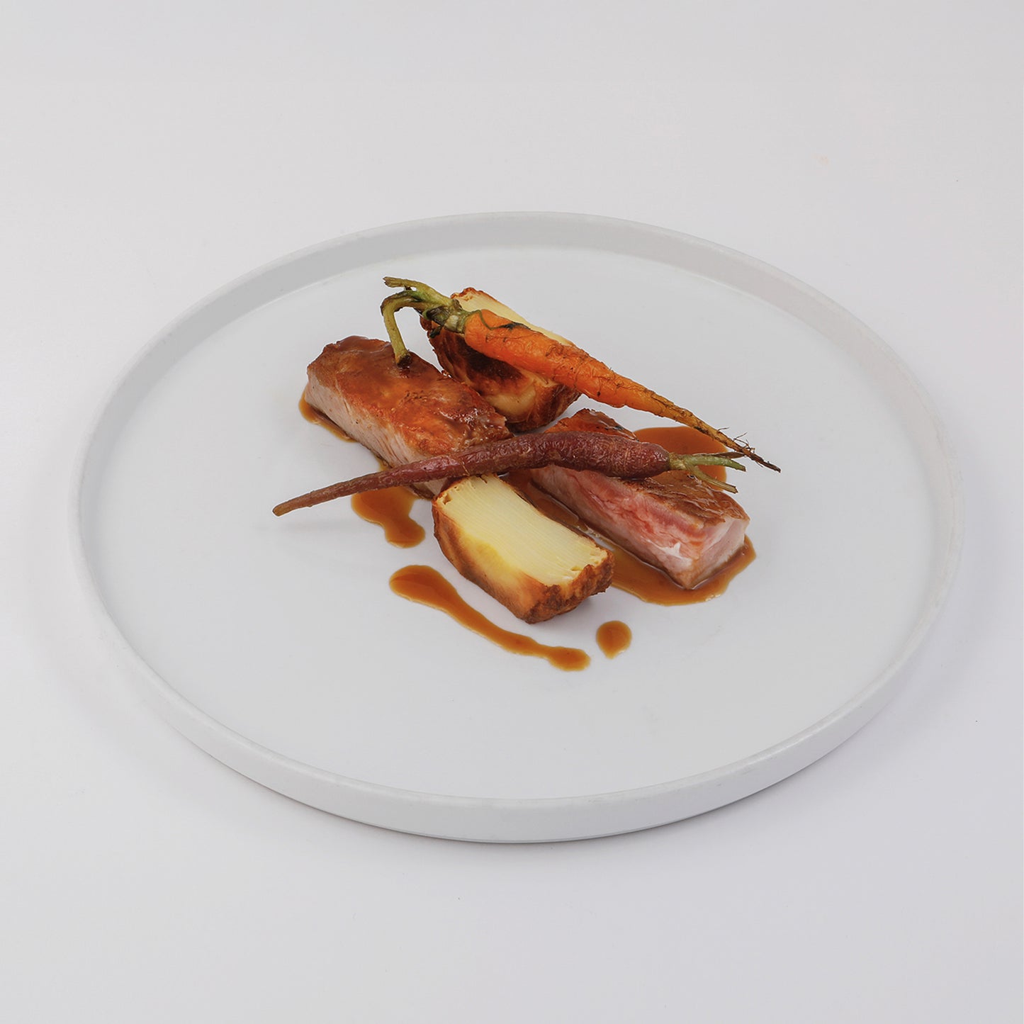 Pluma Iberic pork, buttered baby carrot, potato millefeuille, beef luice