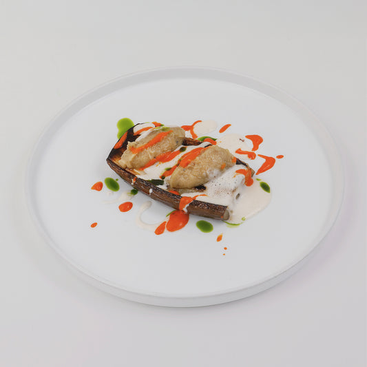 Roasted aubergin, tomato sauce, white sauce, basil oil