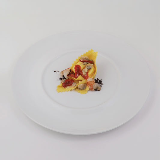 Giant Ravioli with mixed seafood and confit tomatoes