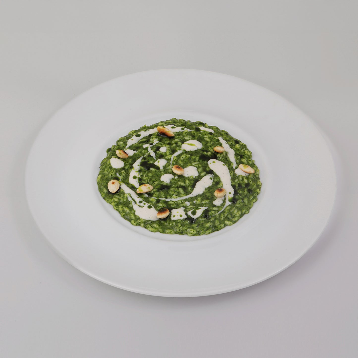 Fresh basil risotto, roasted almonds and robiola cheese