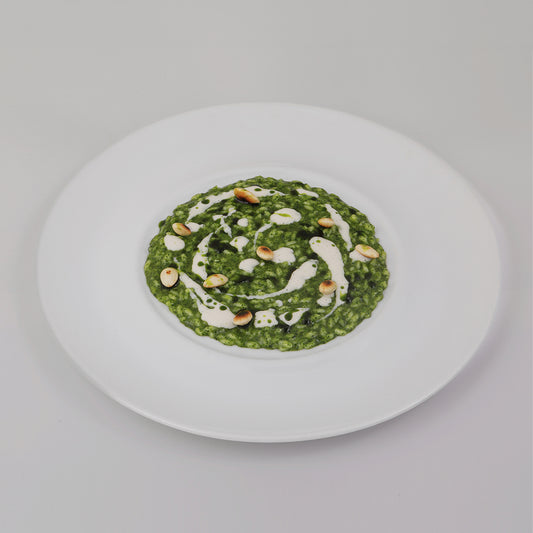 Fresh basil risotto, roasted almonds and robiola cheese