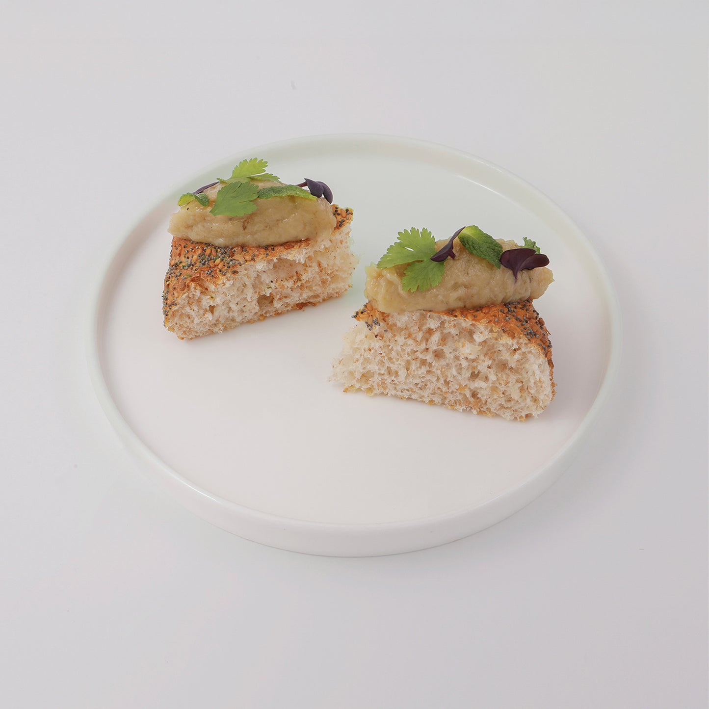 Brioches pizza bun, babaganoush, coriander and mint