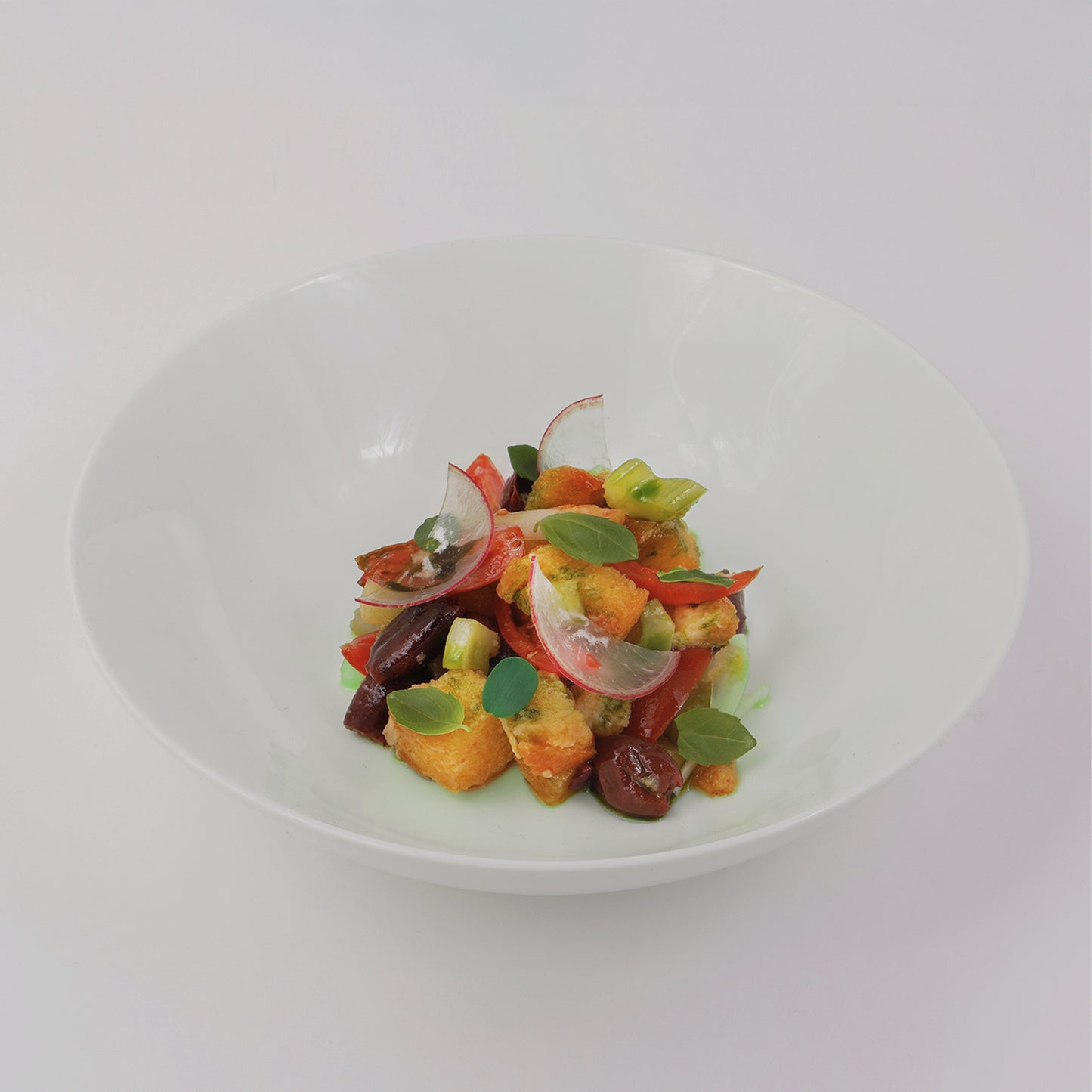 Mediterranean Panzanella salad with bread, celery, onion, cherry tomato,capers and cucumber